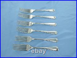 A vintage set of six sterling silver old English dinner forks. London 1936