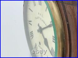 Antique English round Oak cased 8 inch Dial with 8 day mechanical movement