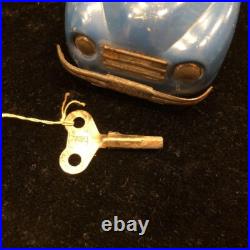 Antique English tin spring-loaded automobile, vintage