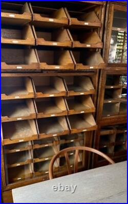 Exceptional 1930s English Oak Vintage Haberdashery Cabinets by Dudley & Co