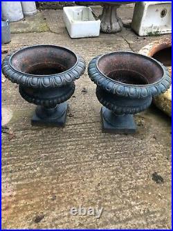 Pair of vintage cast iron urns