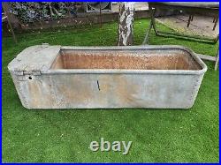 Vintage rivited galvanized water trough rounded top make lovely garden planter