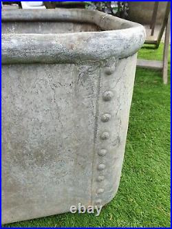 Vintage rivited galvanized water trough rounded top make lovely garden planter