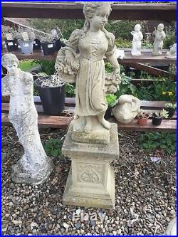 Vintage stone garden statue of a girl