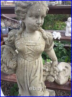 Vintage stone garden statue of a girl